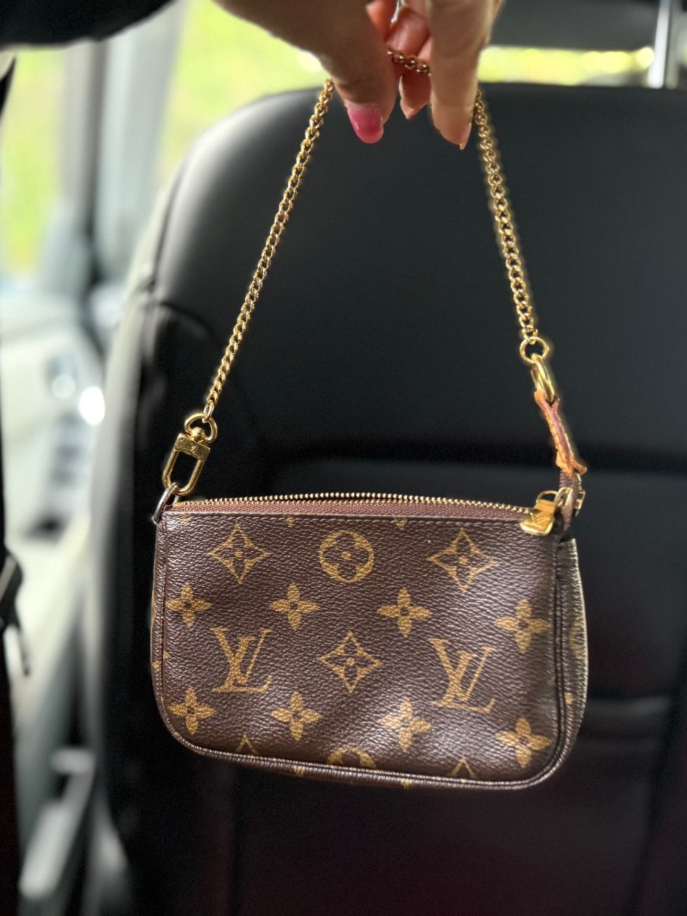 Authentic Louis Vuitton Mini Pochette, with date code, Made in France.